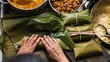 Overhead   shot of person preparing honduran tamales