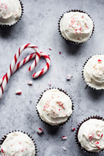 Peppermint Chocolate Cupcakes With A White Chocolate Buttercream Frosting Sprinkled WIth Crushed Candy Canes