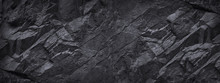 Black Stone Background. Dark Gray Grunge Banner. Black And White Background. Mountain Texture. Close-up. Volumetric. The Rocky Backdrop. Abstract Black Rock Background. Detail.