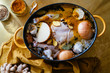 © Lauren Allen - Chicken soup prep with spices in yellow dutch oven