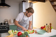 © zinkevych - Man cutting vegetables for a light salad