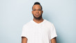 © fizkes - Portrait of serious black man isolated on blue studio background