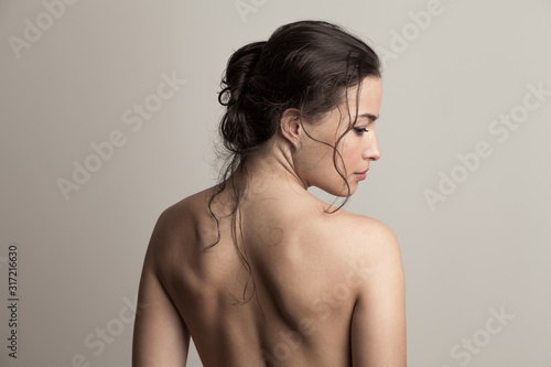 Fotomural natural beauty concept young woman with wet hair in bun profile and back studio
