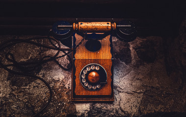 Fototapete - old brown wooden phone near the window.
