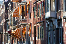 Nostalgic Street With Bay Windows And Awnings In Rotterdam In The Netherlands