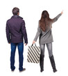 © ghoststone - back view of couple with shopping bags.