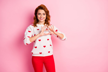 Wall Mural - Portrait of her she nice attractive lovely lovable amorous cheerful cheery kind wavy-haired girl wearing white pullover showing heart sign isolated on pink pastel color background