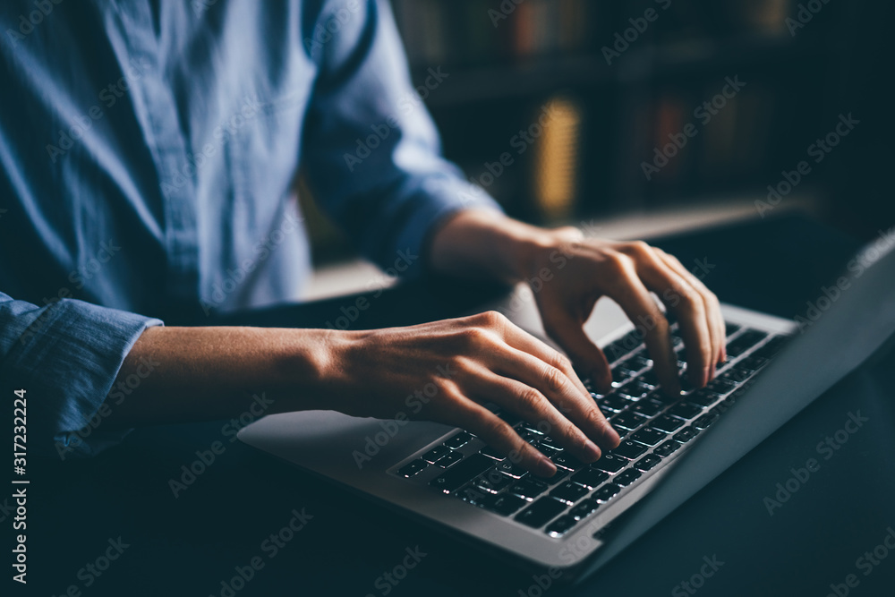 Freelance woman working from home. Close up hand with laptop. - obrazy, fototapety, plakaty 