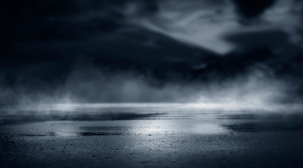 Wall Mural - dramatic black and white background. cloudy night sky, moonlight, reflection on the pavement. smoke 