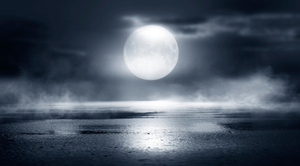 dramatic black and white background. cloudy night sky, moonlight, reflection on the pavement. smoke 