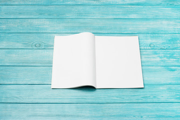 Wall Mural - Mock-up magazine, newspaper or catalog on blue background. Blank page