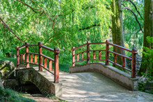 A Small Wooden Bridge In A Summer Park On A Warm Summer Day