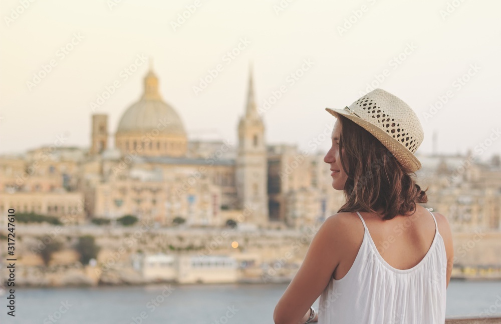 Young woman tourist portrait on vacation in Valletta Malta - obrazy, fototapety, plakaty 