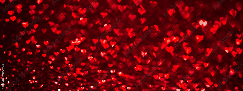 Abstract light, red bokeh pattern in heart shape. St Valentines Day or Holiday concept, background banner image. - obrazy, fototapety, plakaty 