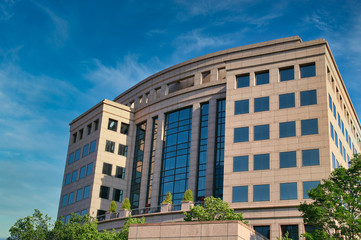 Poster - A modern office building of glass and pink stone