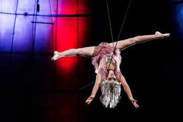 lightning near attractive aerial acrobat performing in circus