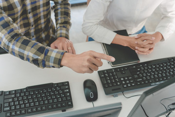 Canvas Print - Young startup Programmers Sitting At Desks Working On Computers screen for Developing programming and coding to find solution to problem on New Application