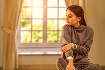 Wall Mural - Slim young woman in home interior and big spring window 