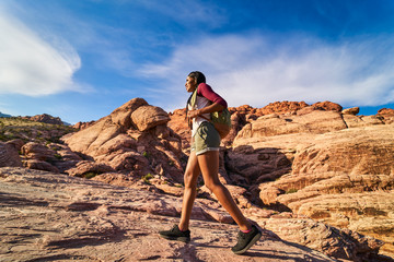 Wall Mural - african american woman hiking on rocky terrain at red rock canyon park