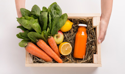 Wall Mural - Fresh fruits and vegetables ingredients in wooden box with healthy cocktail