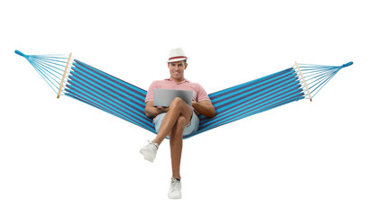 Wall Mural - Man with laptop in hammock on white background