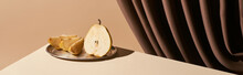 Classic Still Life With Pear On Silver Plate On Table Near Curtain Isolated On Beige, Panoramic Shot