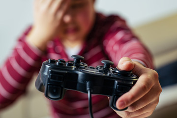 Wall Mural - Closeup image of hands holding the game controller.