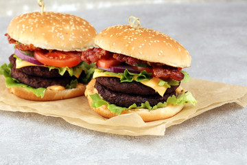 Tasty fresh meat burgers with salad and cheese. Homemade angus burger.