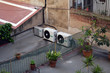 Air Conditioning Units on Flat Roof with Pot Plants