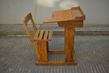 Sticker - Old wooden school seat on the street