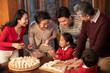 © Blue Jean Images - Happy family making dumplings