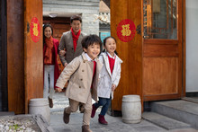 Happy Young Family Celebrating Chinese New Year