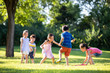 © Blue Jean Images - Happy children playing on meadow