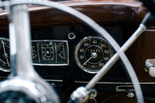 Fragment Of Metal Steering Wheel And Dashboard Of Old Classical Automobile