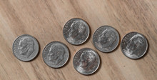 Us Dollar. Coin Bank, One Dime. Photograph Of A Group Of American Dimes.