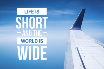 Travel, Adventure and Exploration Quote. Life is Short and The World is Wide. Airplane Wings Against Blue Sky.