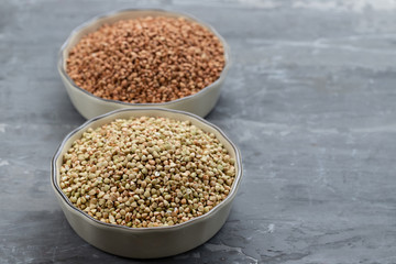 Sticker - green and brown buckwheat in bowl on ceramic background