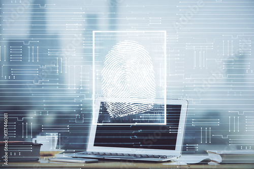 Fotografía Computer on desktop in office with finger print drawing