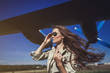 © jozzeppe777 - Portrait of a beautiful woman in Aviator glasses near aircraft