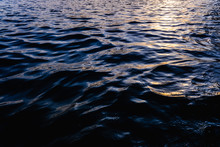 Waves On The Surface Of The Sea Water At Dusk With Compact, Solid And Deeply Calm Texture.