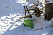 Upside Down Green Wheelbarrow Put On Snow During Daytime