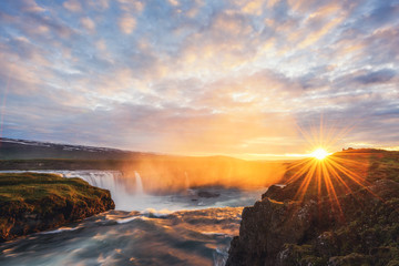 Colorful sunrise on Godafoss waterfall on Skjalfandafljot river, Iceland, Europe. Landscape photography