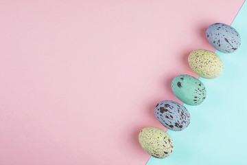 Pastel colorful easter eggs on trendy paper background. Flat lay, top view, copy space