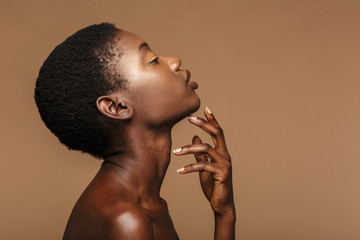 Beauty portrait of young half-naked african woman with short black hair