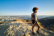 © Joshua Resnick - african american woman standing at runyon canyon looking at view after long hike