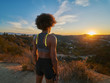 © Joshua Resnick - african american woman watching sunset while resting after hike at runyon canyon