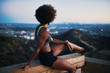 © Joshua Resnick - fit african woman woman resting on bench at runyon canyon shortly after sunset