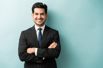 handsome hispanic businessman in black suit