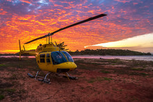 Helicopter On The Land Next To The Sea At Sunset, Australia, Northern Territory, Seisia Cape York