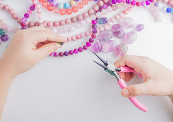 Canvas Print - Child hands with beads